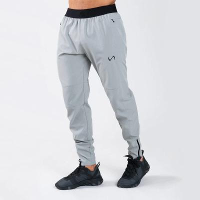 China Custom Spandex Mens Anti-Wrinkle Pocket Cotton Fleece Jogger Sweatpants Slim Fit Sports Pants Gym Fitness Training Cargo Pants for sale