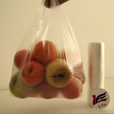 China Impact Resistance Transparent Plastic T Shirt Bags On Roll for sale