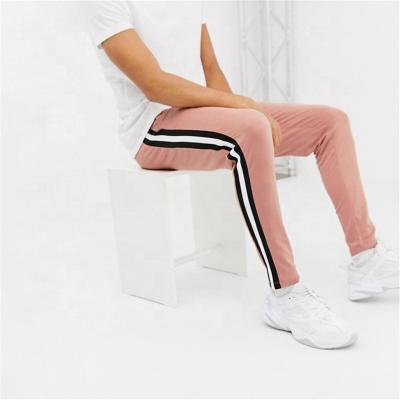 China Anti-pilling logo tracker unisex sweatpants 2020 wholesale custom men's women's custom men's sweatpants for sale