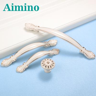 China AIMINO Modern High Quality Zinc Alloy Pull Handle Cupboard Cabinets Luxurious Ivory White Kitchen Handles Knobs for sale