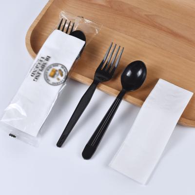 China Viable disposable plastic cutlery set fork spoon and napkin in OPP bag for restaurant logo for sale