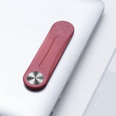 China Laptop Adjustable Colorful Magnetic Expansion Stand Phone Holder Side Notebook Plastic Phone Holder for sale