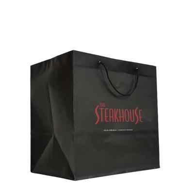 China Recycled Materials Custom Printed Your Own Logo Cardboard Kraft Paper Gift Craft Shopping Black Paper Bag With Handles for sale