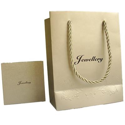 China Newest Logo Christmas Gift Luxury Custom Printed Paper Bags Shopping Clothes Gift Paper Bag And Handle for sale