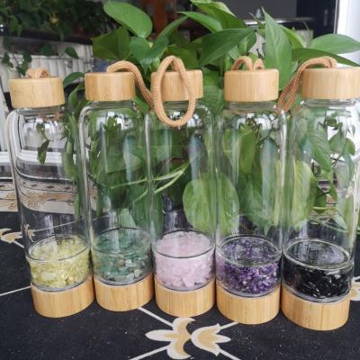 China Viable Sale Crystal Water Bottle Custom Glass Logo Crystal Energy Water Bottle Bamboo Mess for sale