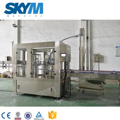 China Automatic Small Scale Bottle Water Filling Machine Juice Beverage Water,Glass Bottle Liquid Filling Machines With Conveyor Belt en venta