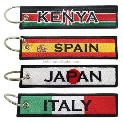 China Kofei Shape Key Chain Jet Tag Embroidered Woven Flag Durable Custom Key Ring Motorcycle Embroidery Key Chain for sale