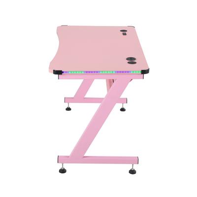 China Fashion Gaming Desk Professional Workstation RGB Z Shape Height Adjustable Gaming Table PC Desk With Led for sale