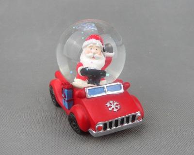 China Resin Christmas Santa snowglobe from Europe, polyresin Santa on car snow globe, funny Christmas car decoration for sale