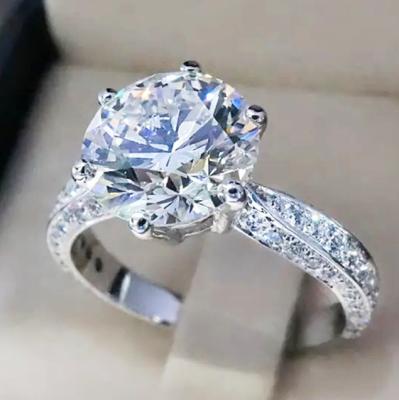 China Huitan Romantic Brilliant Wedding Jewelry Micro Cubic Pave Anillos Luxury Silver Big Round Brilliant CZ Gemstone Women Rings for sale