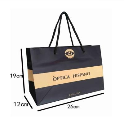 China Recyclable Luxury Gold Foil Stamping Custom Bags Logo Shopping Black Cardboard Paper Bags for sale