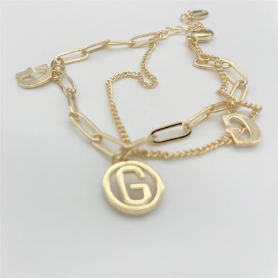 China Fast Delivery 14K Gold Plated Simple Cute Letter Bracelet Initial Pendant Paperclip Chain Bracelet Gold Layered Bracelets For Women for sale