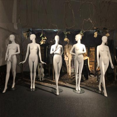 China Stand Abstract Mannequin Woman With Face , Matte White Female Clothes Display Mannequin for sale