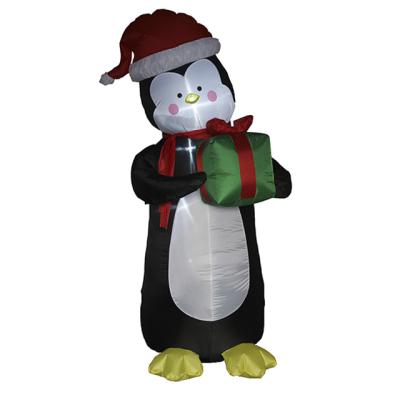 China Hot Selling Outdoor Holiday Decorations 5FT Customized New Christmas LED Lights Inflatable Penguin With Gift Box for sale