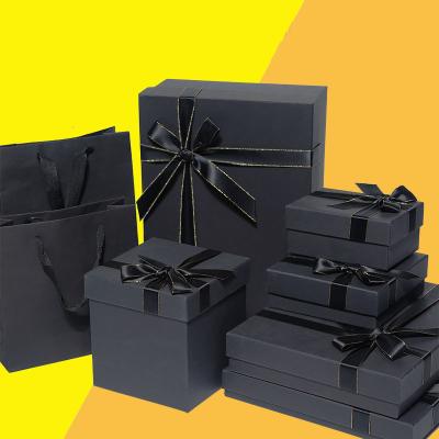 China Recyclable Recycled Perfume Packaging Black Cardboard Boxes Gift Boxes With Ribbon Box Designs for sale