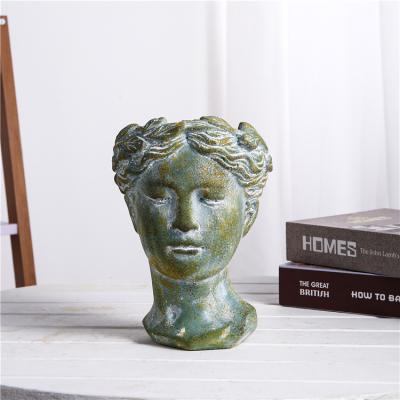 China Wholesale Bulk New Arrival Nordic Indoor Outdoor Table Vintage Green Cement Head Face Garden Decorative Planters for sale