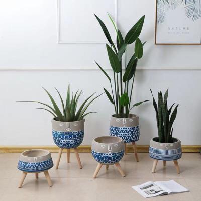 China Wholesale New Arrival Multicolor Indoor Decorative Flooring Concrete Planters Plant Pots With Foot Stand for sale