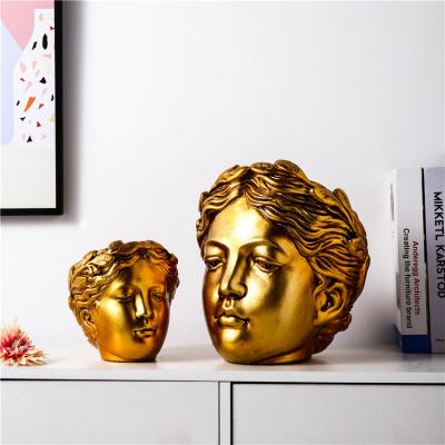 China Novelty Design Unique Modern Gold Nordic Ornaments Concrete Face Home Decoration And Garden Luxury Home Decor for sale