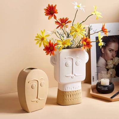 China Wholesale Bulk Novelty Art Design Matte Embossed Face Nordic Indoor Decoration Ceramic Vase For Home Decor for sale