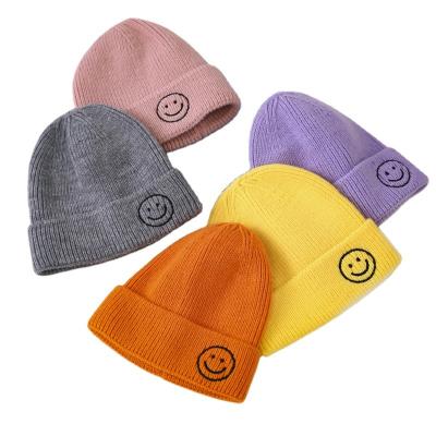 China New Design Kids Winter COMMON Hats Warm Knitted Hat Smile Embroidered Beanie Hat For Baby Custom Made for sale