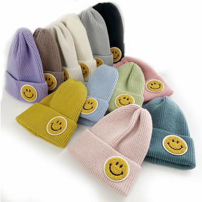 China COMMON High Quality Women's Winter Beanie Hats Luxury Candy Color Knit Hat Smiley Face Label Knitted Hat for sale