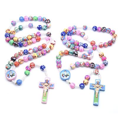 China Handmade Colorful 8mm Religious Beads Clay Children's Catholic Sacred Cross Rosary Bracelet Pink For Prayer for sale