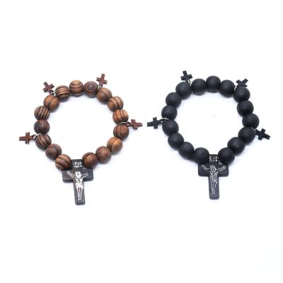 China 2022 Wholesales Religious Catholic Wood Beads Crucifix Bracelets Pendant Benedict Stretch Charm Wrist Men Saint Cross for sale