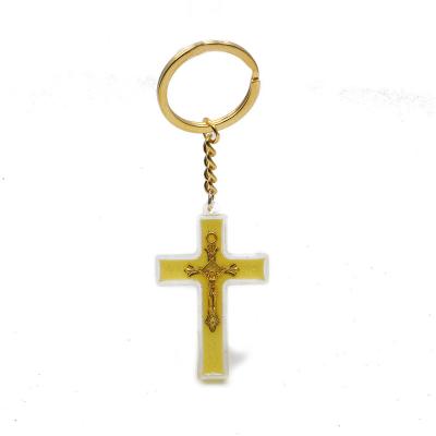 China Religious Luminous Plastic Crucifix Cross Pendant Jewelry Wholesales Gift Keychain Religious Saints Key Rings for sale