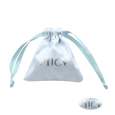 China Eco-friendly high quality custom made microfiber fabric jewelry velvet pouch bag with embossed logo for sale