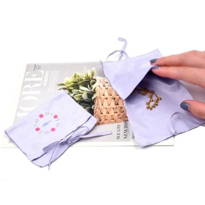 China Eco - Friendly Custom Printed Wrap Suede Jewelry Pouches With Ribbon for sale