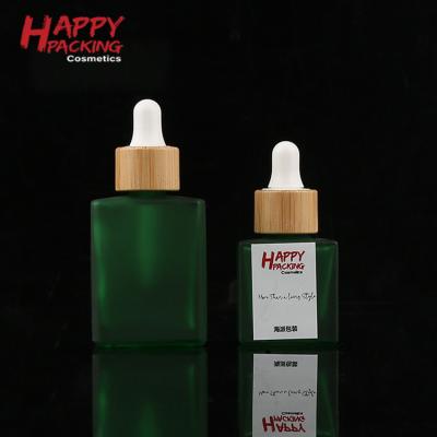 China Cosmetic Packaging Square Green Dropper Bottle 15ml Green Essential Oil Bottles 30ml For Beard Oil for sale