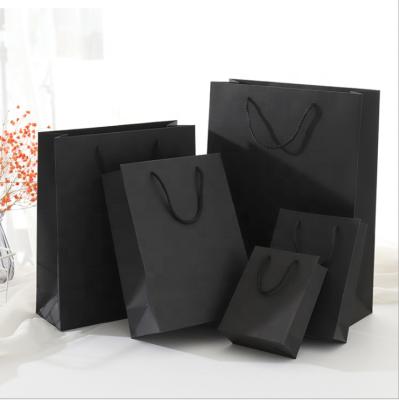 China Gold Foil Paper Sack Recyclable Kraft Paper Bag Black Recycled Paper Shopping Bag With Cotton Handle for sale