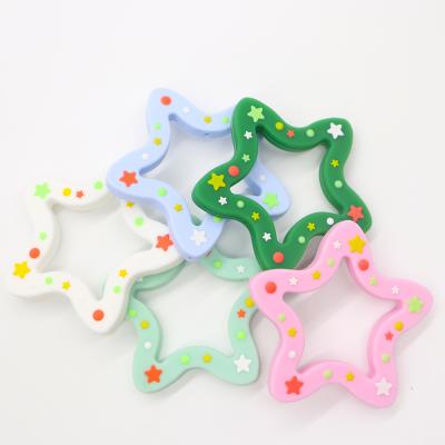 China Baby Toy Hot Sale Food Grade Christmas Star Silicone Soft Safe Teether for sale