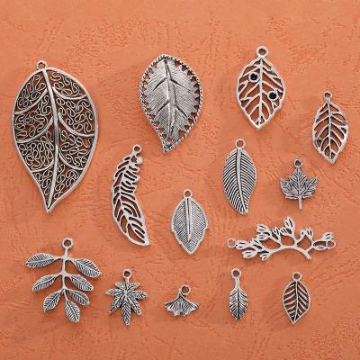 China Vintage Vintage Alloy Maple Leaf Charms Dangling Hollow Out Style Leaf Charm For Necklace Earrings Bracelet Making for sale