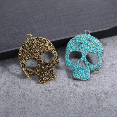 China Custom Factory Environmentally Friendly Retro Women's Retro Alloy Skull Fashion Cavity Hollow Skull Pendant For Ear Studs for sale