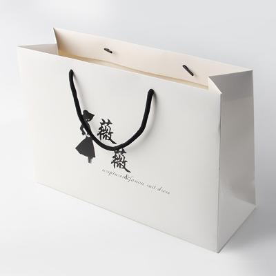 China Recyclable Commercial Printing Custom Design Apparel Gift Handbag Brand Promotion Paper Bag for sale