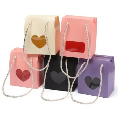 China Recycled Materials Kraft Paper Favor Bag Cupcake Boxes Lilac Pink Wedding Gift Box With Handle Nuts Package Box for sale