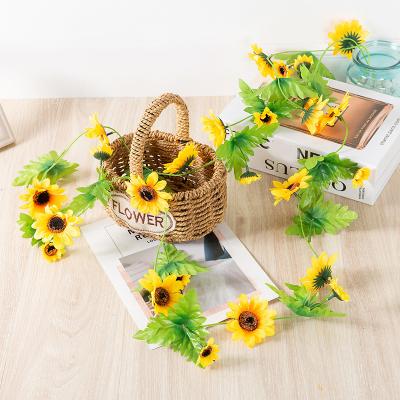 China Beautiful Sun flower rattan sunflower flower rattan wedding home background decoration colorful artificial sun wall winding outdoor winding rattan for sale