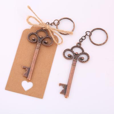 China Retro Viable Factory Wholesale Creative Zinc Alloy Bottle Opener Wedding Gift Key Chain Pendant for sale