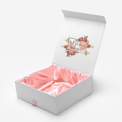 China Handmade Custom Empty Wig Ribbon Closure Gift White Magnetic Flat Cardboard Packaging Folded Paper Box for sale