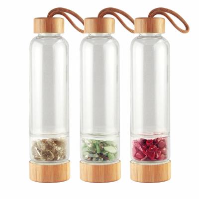 China 550ml Borosilicate Glass Eco-friendly Sustainable Water Bottle With Natural Crystal Point Bamboo Lid for sale