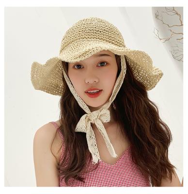 China Wide Female Sun Visor Hat Summer Picture Straw Hat Bow Grass Vacation Beach Outdoor Sun Protection Hat for sale