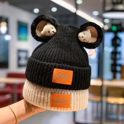 China Winter COMMON Knitted Hats For Women Geometric Wool Knitted Hat Solid Bear Ear Beanie Handmade Hat for sale