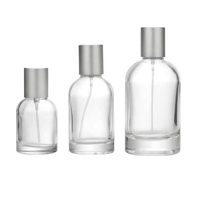 China Refillable Bottle In Stock 30ml 50ml 100ml Round Clear Glass Perfume Bottle Empty Glass Perfume Bottle With Spray for sale