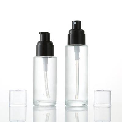 China Essential Oil Clear Glass Bottles 30ml 50ml 60ml 80ml 100ml Cosmetics Bottles Glass Lotion Bottles With Pump for sale