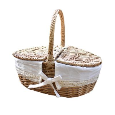 China Bohemian outdoor gift increasing travel camping fruit food wine wicker picnic rattan storage basket handle for sale