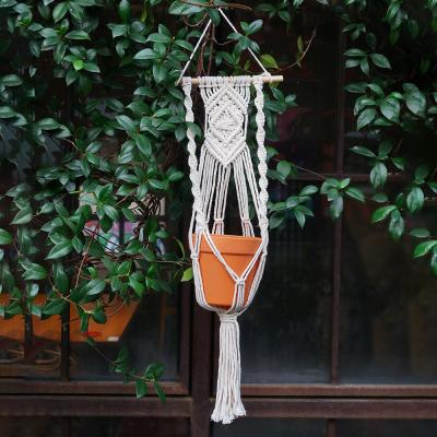 China Handmade Macrame Home Plant Hanger Art Decor Bohemia Cotton Natural Hanging Planter for sale