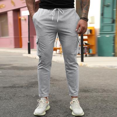 China Breathable Newcomers Pocketed Slim Fit Sweater Casual Solid Stacked Drawstring Pant Joggers Men for sale