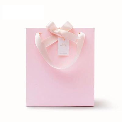 China Recycled Materials Custom Your Own Logo Shopping Luxury Paper Packaging Bags Pink Wedding Gift Bags Food Candy Bags for sale