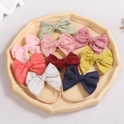 China Softly 2021 New Wholesale Children's Hair Accessories Elastic Colorful Cloth Bow Knot Cute Hair Band For Baby And Child for sale